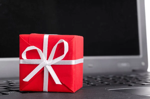 Gift on a laptop keyboard — Stock Photo, Image