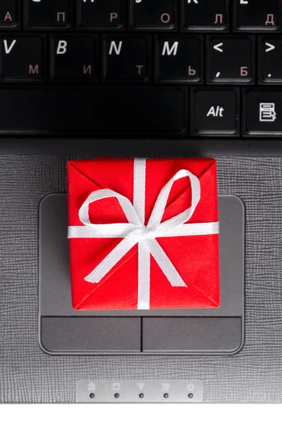 Gift on a laptop keyboard — Stock Photo, Image
