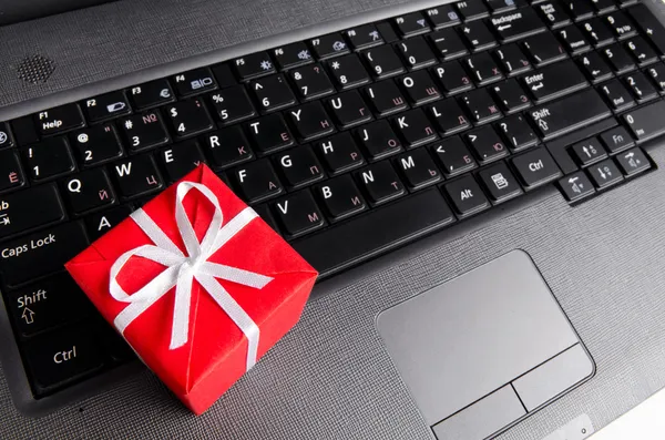 Gift on a laptop keyboard Royalty Free Stock Photos