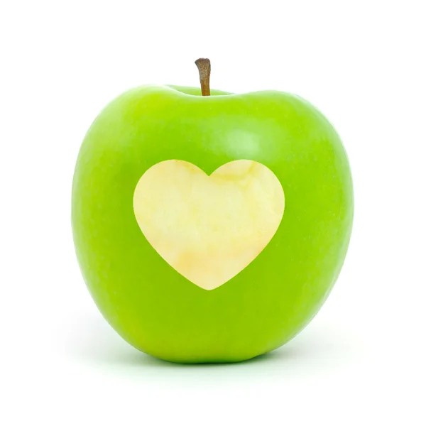 Green apple with a heart symbol — Stok fotoğraf