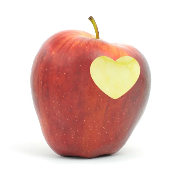 Червоне яблуко з символом серця — стокове фото