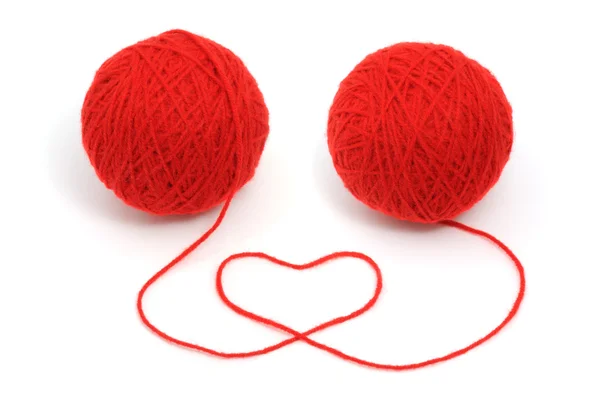 Red yarn with heart symbol — Stock Photo, Image