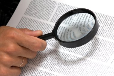 Magnifier in hand clipart