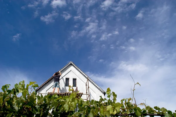 House under clouds — Stock Photo, Image