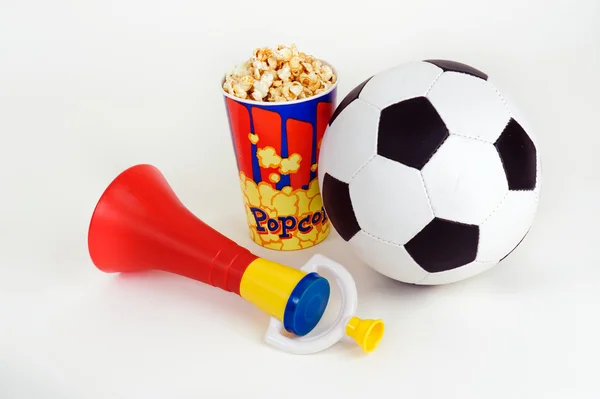 Soccer fan trumpet with ball & popcorn — Stock Photo, Image