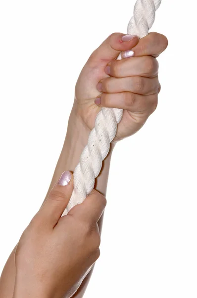 Kobiety w rękę pullind linowy — Zdjęcie stockowe