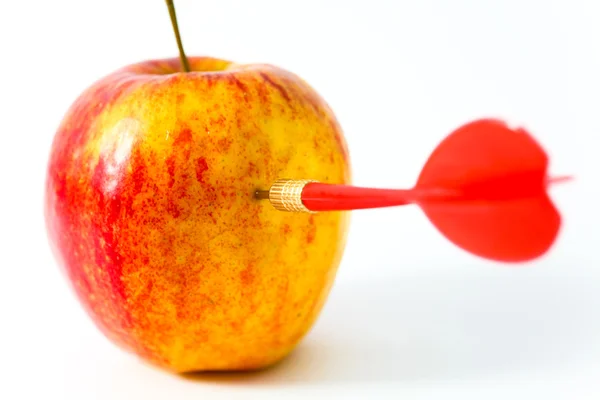 Red apple with red dart — Stock Photo, Image