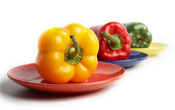 Peppers on saucers — Stock Photo, Image
