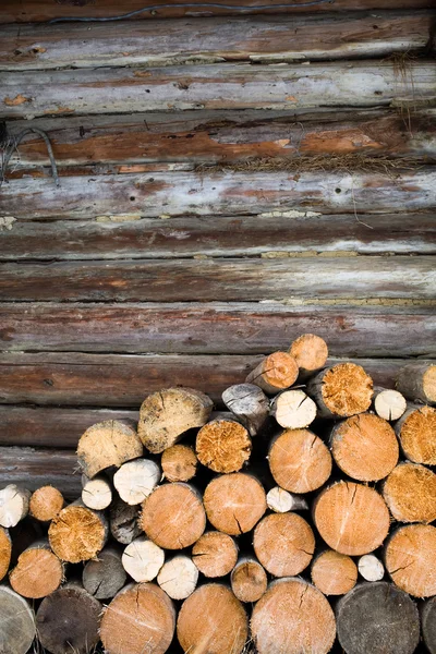 Logs at wall — Stock Photo, Image