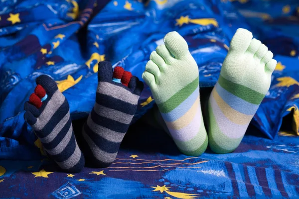 Fødder i sokker - Stock-foto