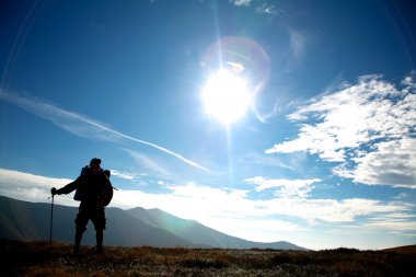 Tourist on a hill clipart