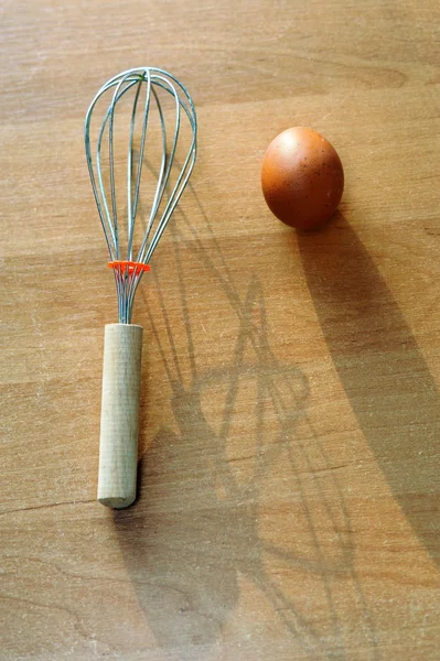 Egg with whisk — Stock Photo, Image