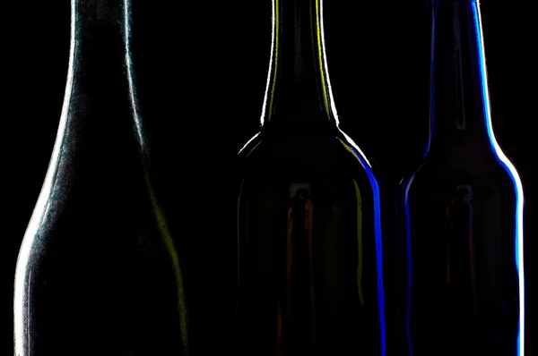Три силуэта бутылок — стоковое фото