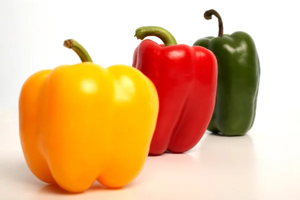 Color peppers in row — Stock Photo, Image
