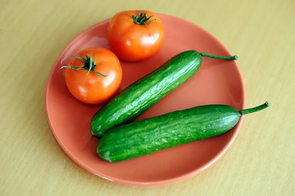 Tomatoes with cucumbers — Stock Photo, Image