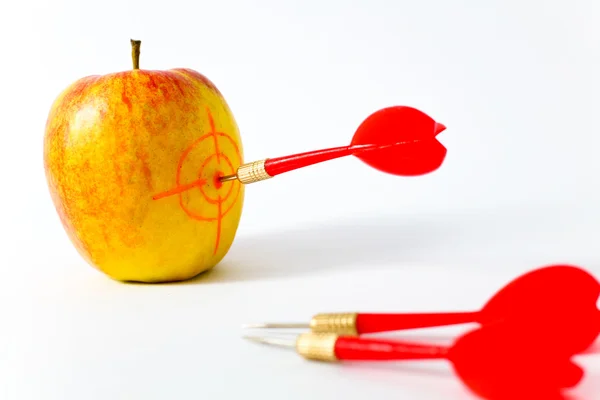 Red-yellow apple with darts — Stock Photo, Image