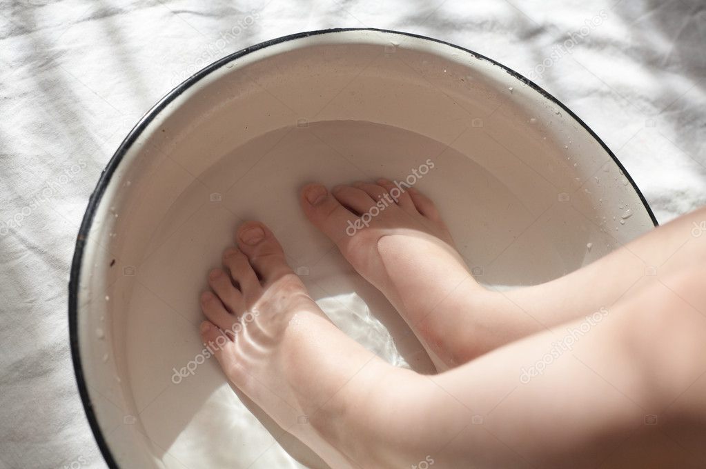 Child's feet in water