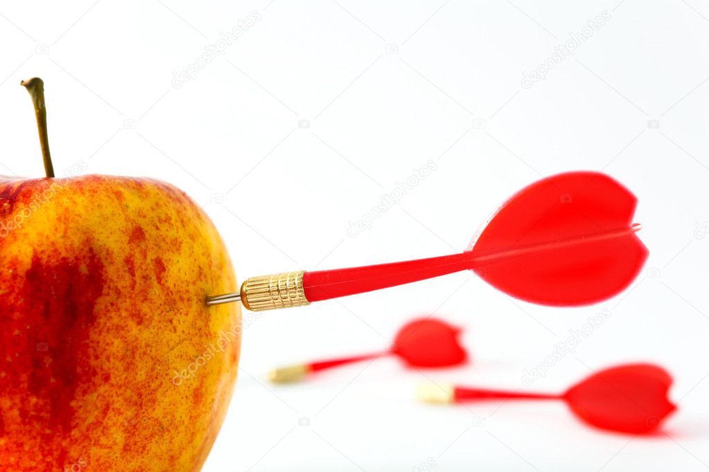 Red apple with darts
