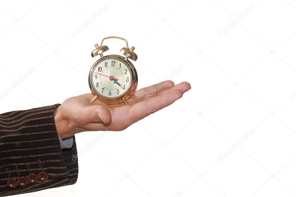 Alarm clock in palm