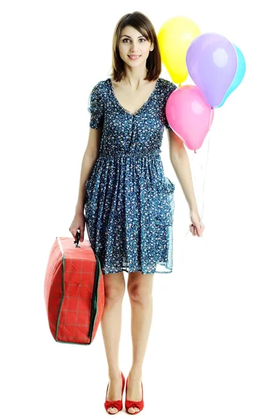 Mladá žena s kufrem & balóny — Stock fotografie
