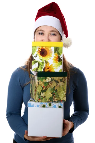 A surprised girl in a cap with three gift boxes — Stock Photo, Image