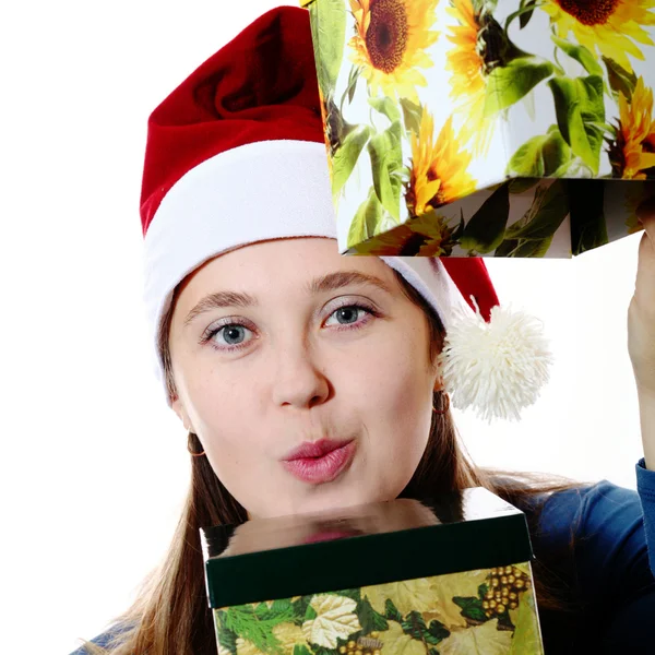 A surprised girl in a cap with boxes — Stock Photo, Image