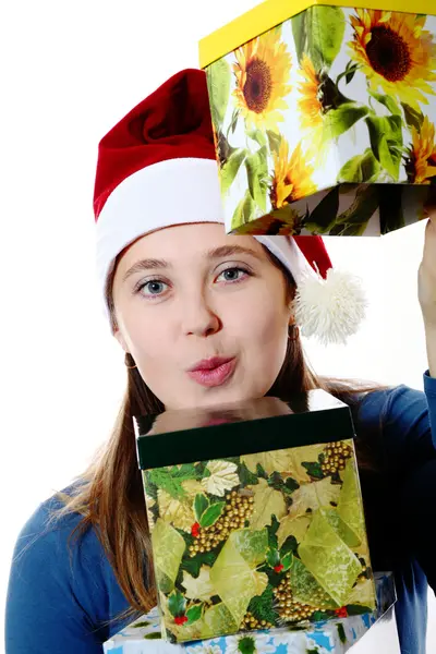 A surprised girl in a cap with boxes — Stock Photo, Image