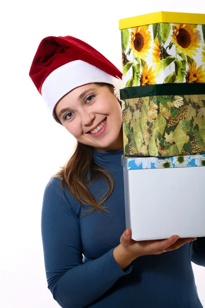 A nice girl in a cap with three boxes — Stock Photo, Image