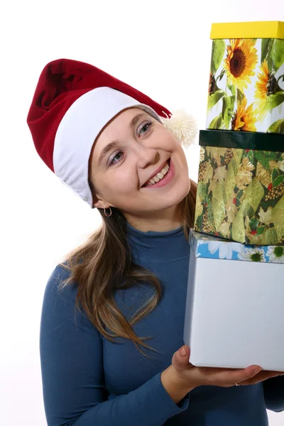 Chica sonriente en una gorra con tres cajas —  Fotos de Stock