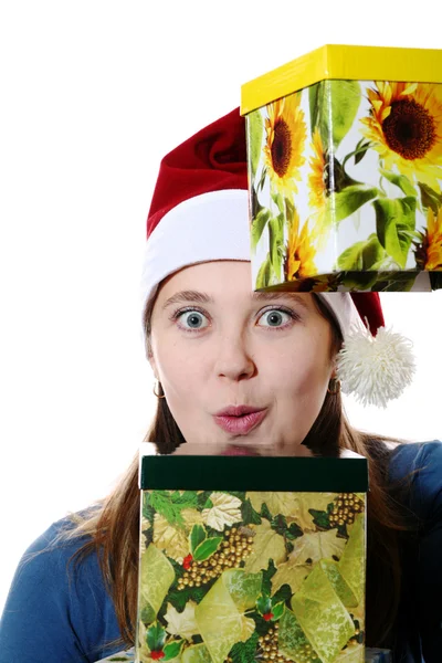 A surprised girl in a cap with two gift boxes — Stock Photo, Image