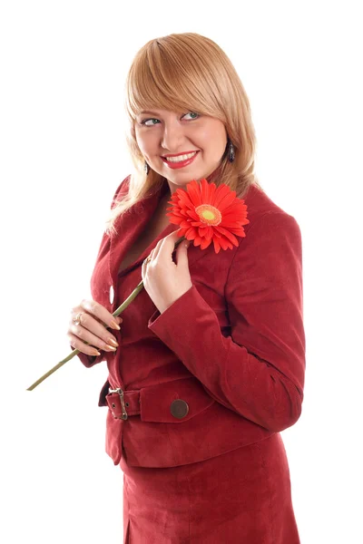 Smiling girl in red with red flowers — Stock Photo, Image