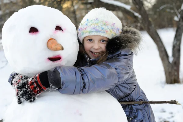 stock image Posing with snowman