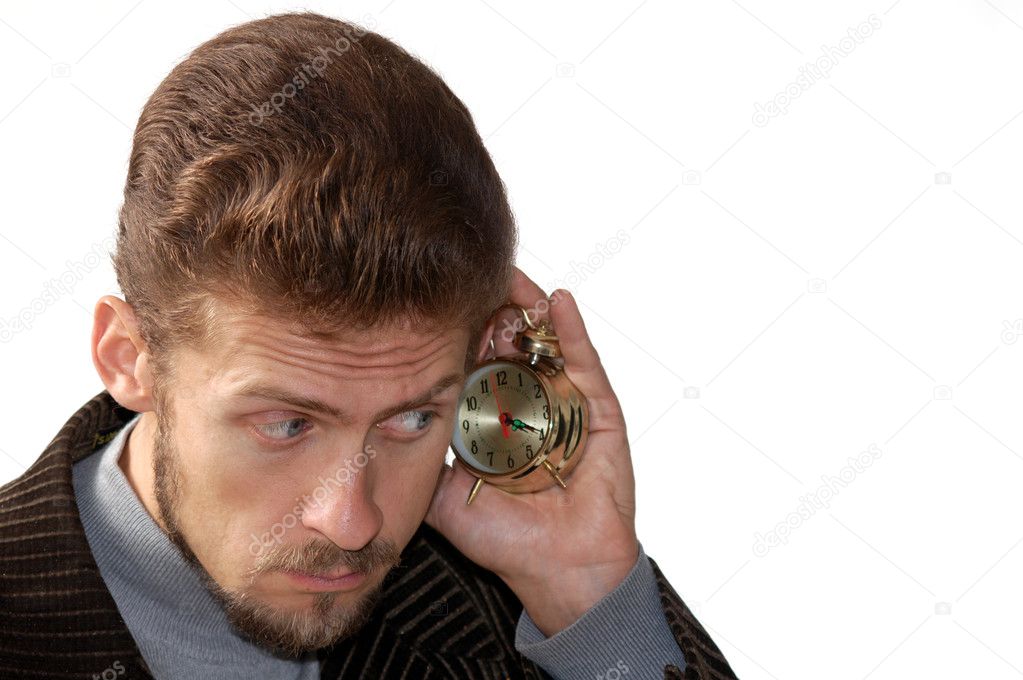 Man listening alarm clock