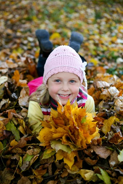 In yellow leaves — Stock Photo, Image