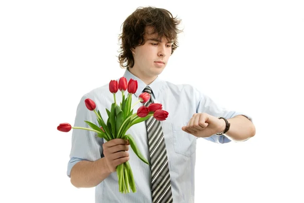 Muž s tulipány — Stock fotografie