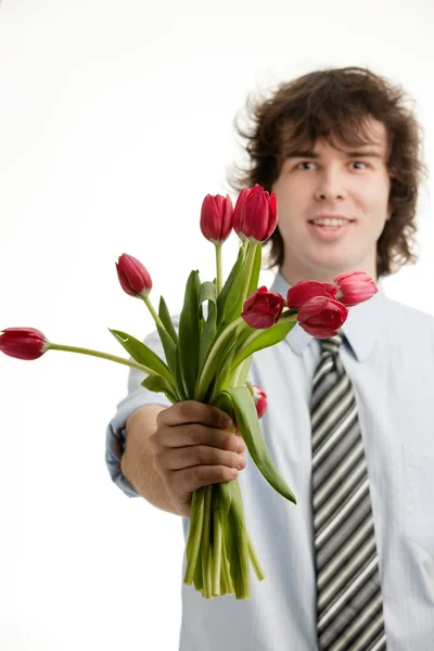 Muž s květinami — Stock fotografie