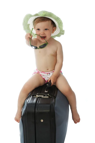 Baby in hat on a valise — Stock Photo, Image