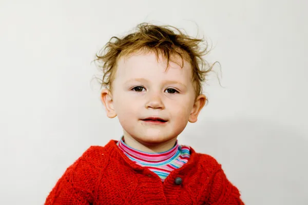 Smiling boy with dishevelled hair — Stock Photo, Image