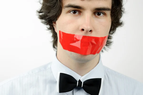 Tape on his mouth Stock Picture
