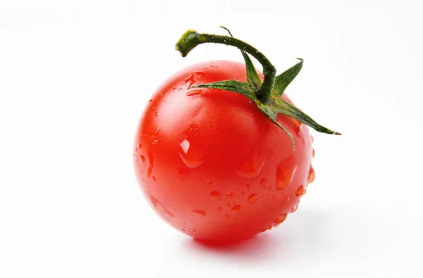 Red tomato with drops of water on it — Stock Photo, Image