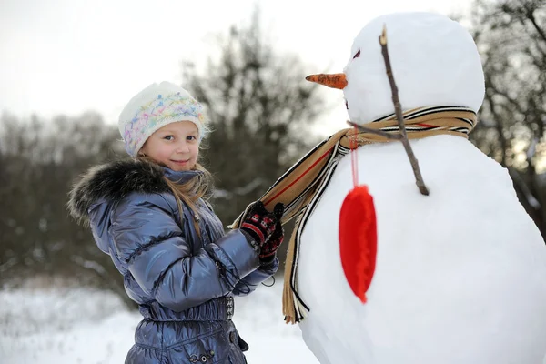 stock image Girl with snowman