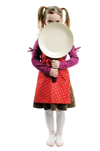 A little girl with frying pan — Stock Photo, Image