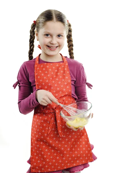 A little girl stirring something in a bowl — Stock Photo, Image