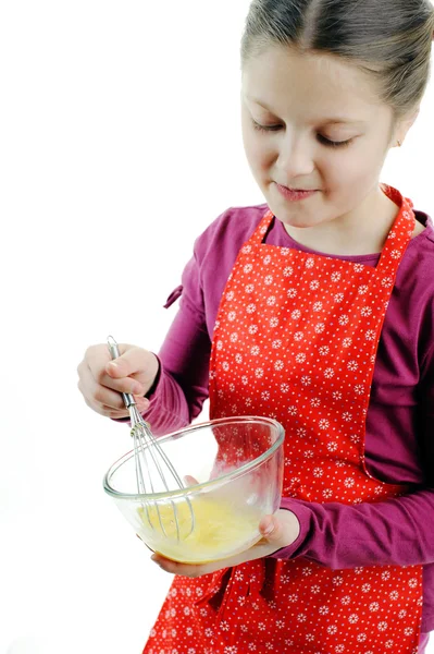 A little girl stirring something in a bowl — Stock Photo, Image