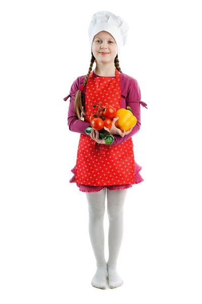 A little girl with fresh vegetables — Stock Photo, Image