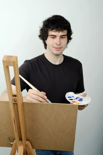 A young man drawing a picture — Stock Photo, Image