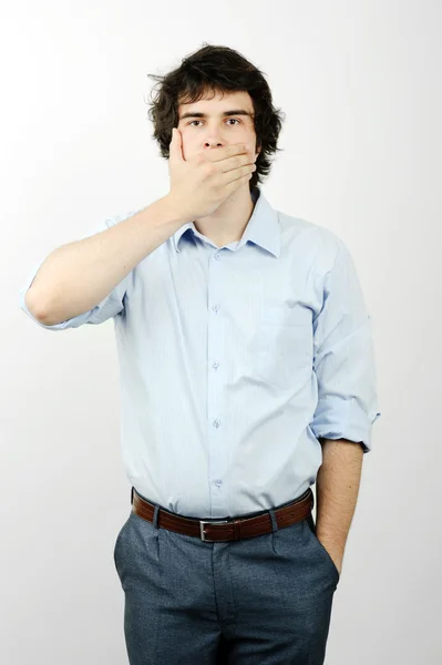 A man with his hand on his mouth — Stock Photo, Image