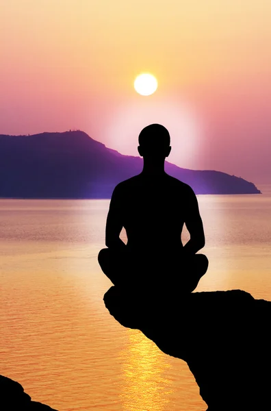 Silhouette of the meditating person — Stock Photo, Image
