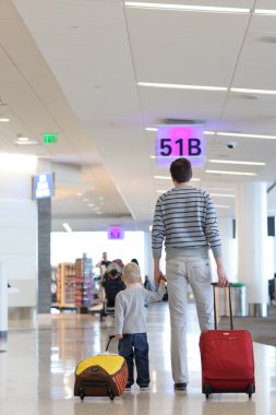 Father and son at the airport clipart