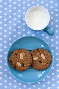 Oatmeal cookies with cup of milk clipart